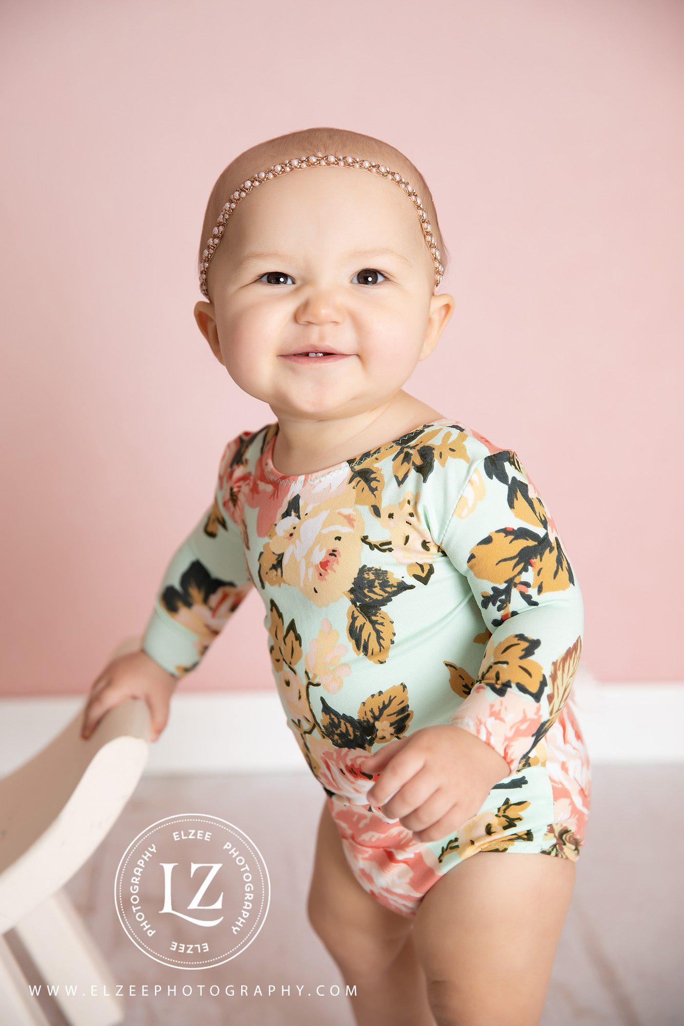 Baby girl in floral romper, baby photography 